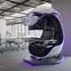 The Cooler Master Orb X shown sitting in a large office space full of tables and chairs.
